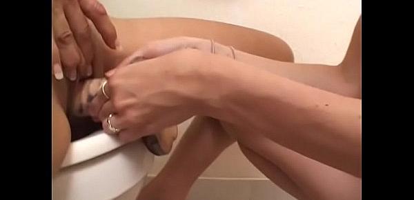  Young babe are very happy when her twat gets drilled wth toy by  mature lady Summer Ann sitting on the  toilet bowl